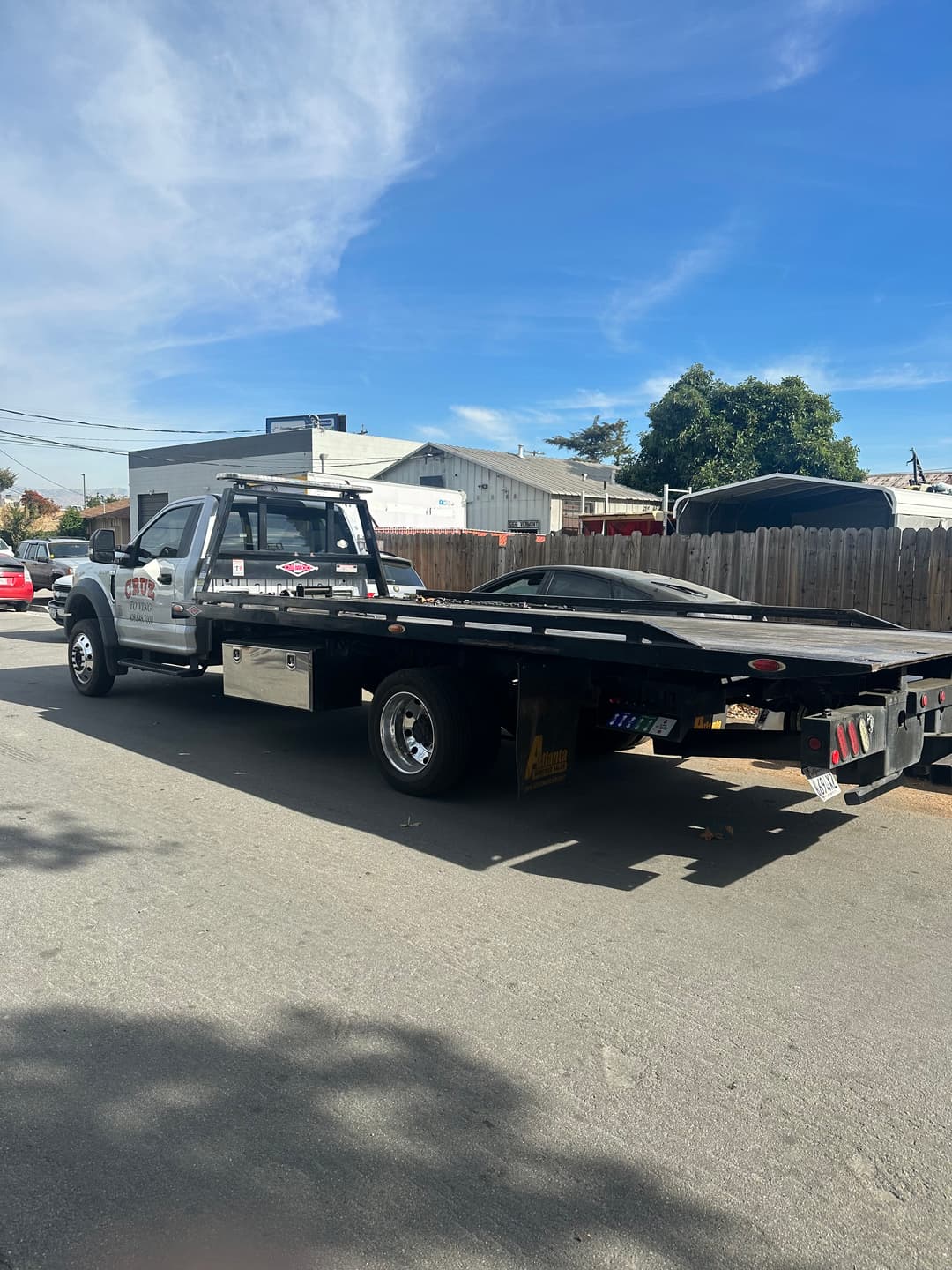 Professional cleaner scrubbing shower tiles during deep bathroom cleaning
